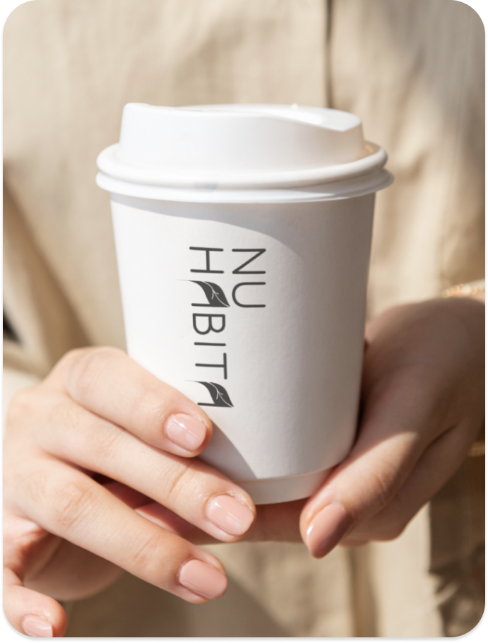 project cover image the logo designed for Nu Habita in a coffee takeaway cup